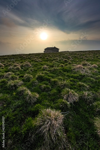 Sunset lights on the meadows of Malga Pidocchio. Erbezzo, Lessinia, Veneto, Italy. photo