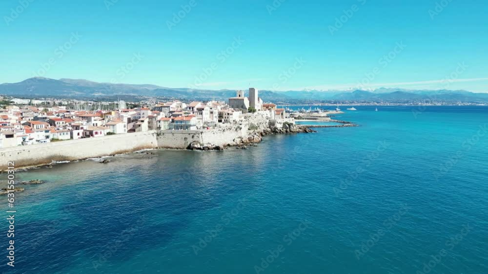 Aerial of the white buildings of Brindisi city in Italy alongside the blue sea Aerial of the white buildings of Brindisi city in Italy alongside the blue sea