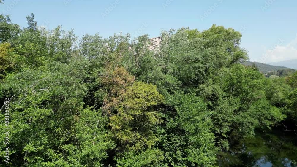 Aerial of the beautiful old Bussi sul Tirino commune in Italy surrounded by green trees Aerial of the beautiful old Bussi sul Tirino commune in Italy surrounded by green trees