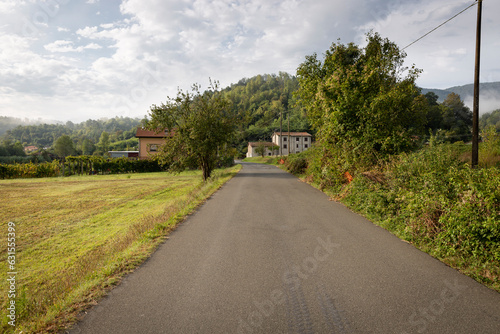 a country road passing through an hamlet next to Pomarino village, municipality of Aulla, province of Massa-Carrara, Tuscany, Italy photo