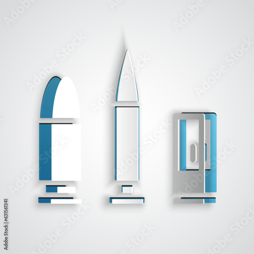 Paper cut Bullet and cartridge icon isolated on grey background. Paper art style. Vector