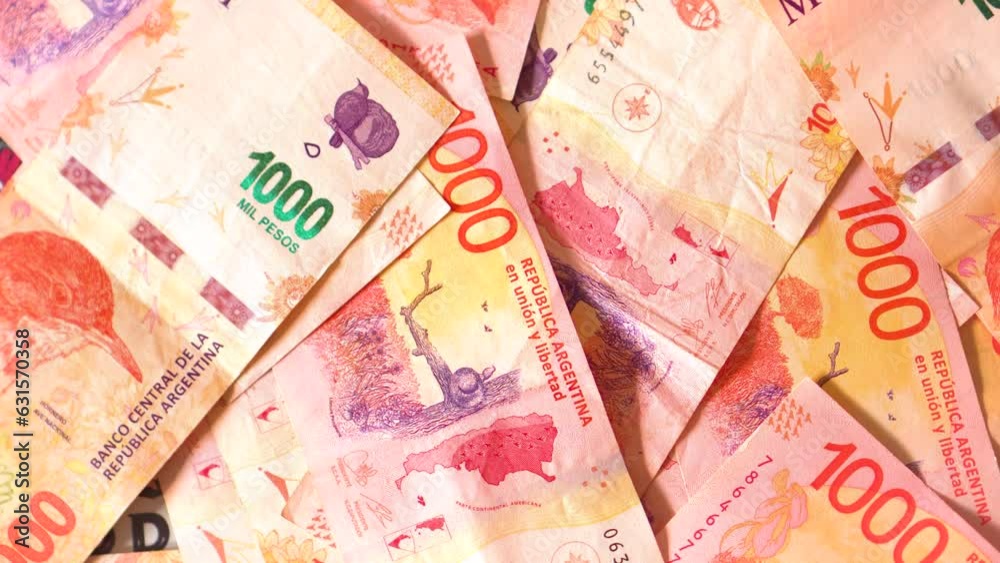 Lots of argentine pesos bills mixed in one thousand and five hundred bills