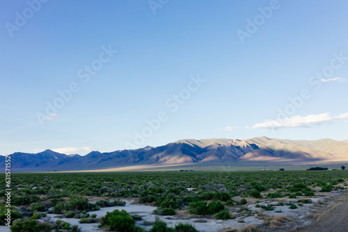 A beautiful landscape with big mountains at sunset. Blue clear sky above mountains on a sunny summer day at sunset