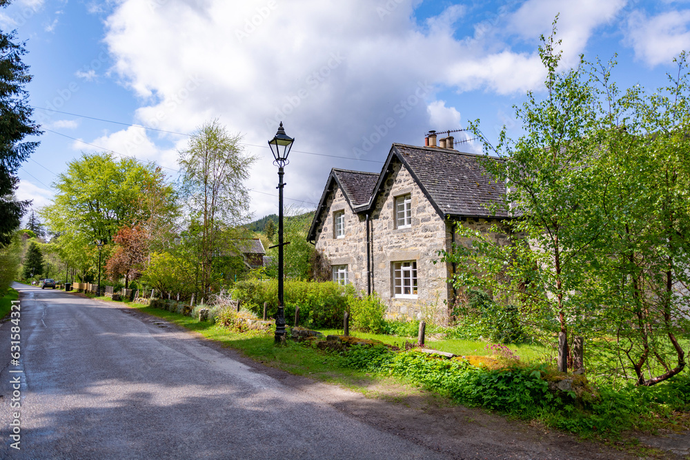 Beautiful Tomich with traditional houses in the Scottish highlands