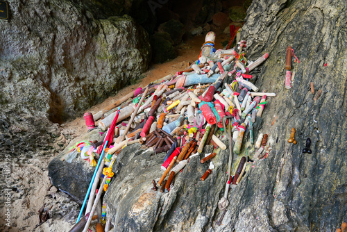 Wooden sculptures of phalluses of different colors in the Princess Cave, a buddhist temple on Phra Nang Cave Beach on the Railay Peninsula in the Province of Krabi, Thailand