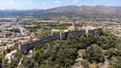 Castle of Capdepera on the Balearic island of Majorca in the Mediterranean Sea - Medieval walled fortress built on a slope covered with maquis photo