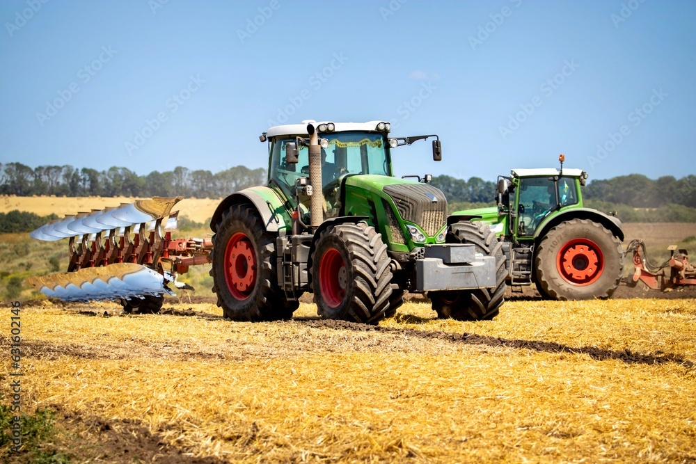 Fototapeta premium tractor with plow in field