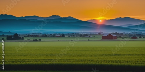 a huge landscape with mountains far and big crop farms in foreground at sunrise