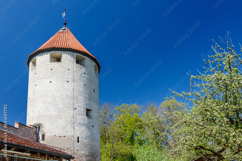 Old cylindrical tower with red tiled roof