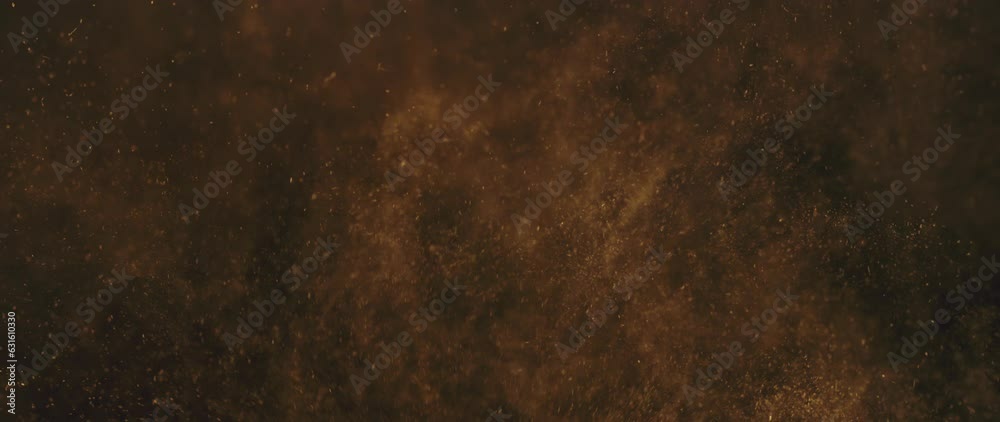 Slow-motion shot of floating dust particles in the air. Dust in the room with dark background
