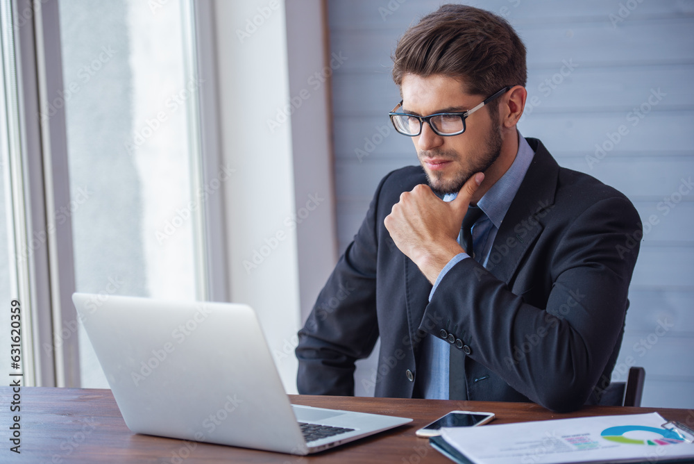 Handsome young businessman working Handsome young businessman working