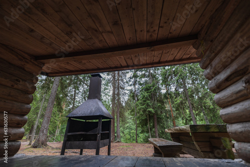 Place for outdoor recreation in Estonia in the forest, camping place, barbecue, wooden table and benches.