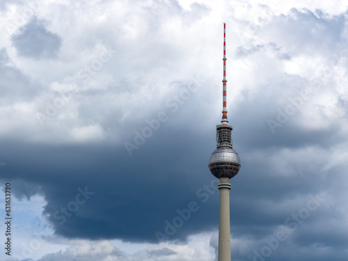 Alexanderplatz TV tower on the beautiful blue sky background with clouds.