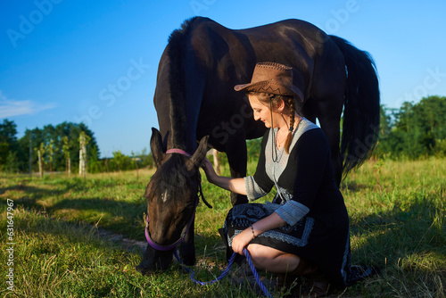Beautiful girl with horse on the sunset