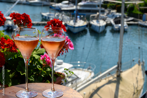Photography Summer party, drinking of French brut rose champagne sparkling wine in glasses i