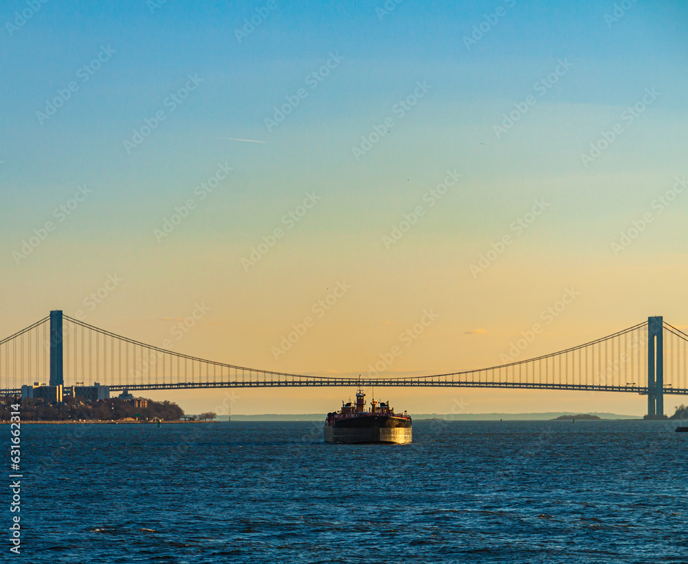 Small Tanker Passing The Verrazano-Narrows Bridge on The Hudson River, New York, New York, USA