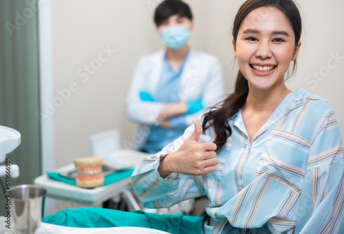 Healthcare and medicine concept.Happy asian woman look at camera and visiting a dentist office .