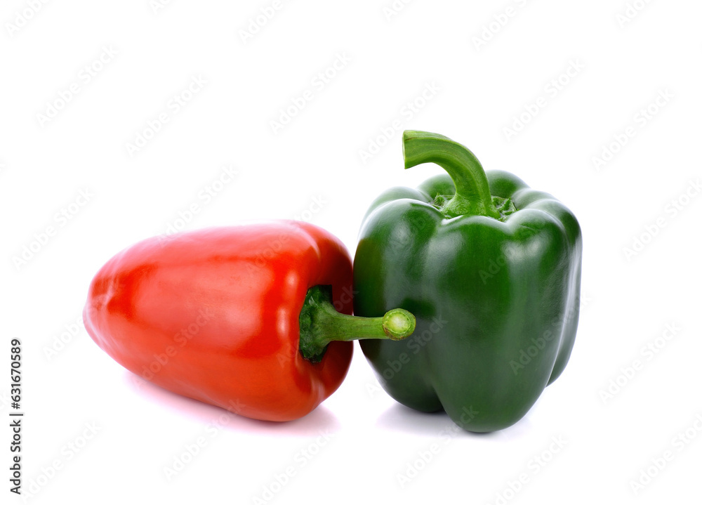 Green and red peppers on white background Green and red peppers on white background