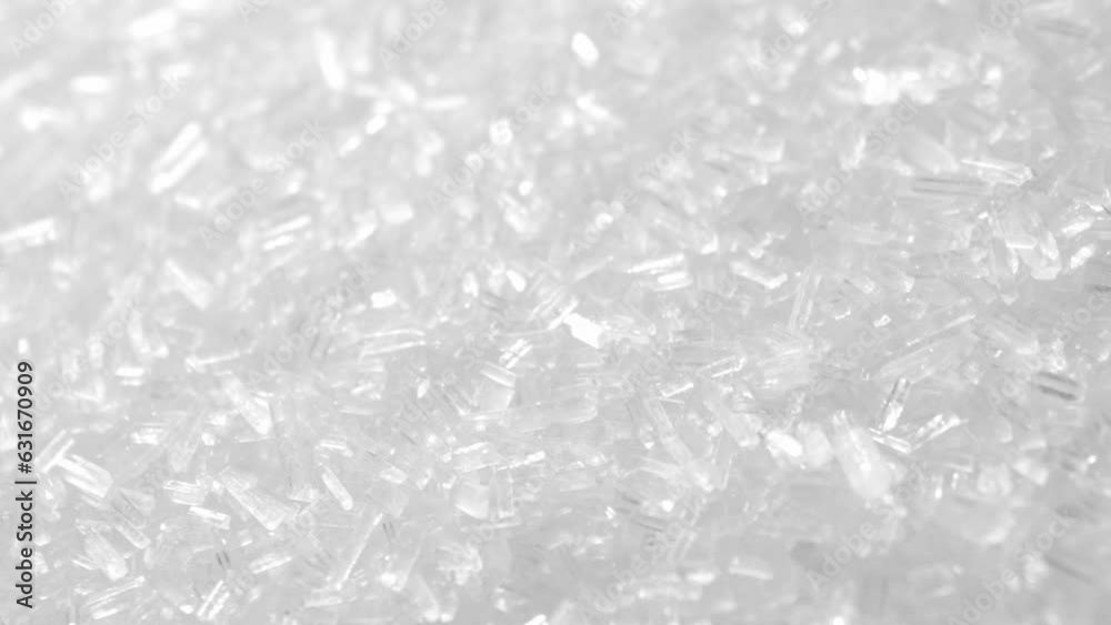 Macro video of MSG, a flavor enhancer commonly used in foods. Crystalline texture and reveals
