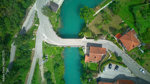 Aerial top down drone view of Most na Soci, a town in the Municipality of Tolmin in the Littoral region of Slovenia on Soca river..
