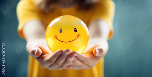 Woman hand holding happy smile sphere, Positive thinking, Mental health assessment , World mental health day concept