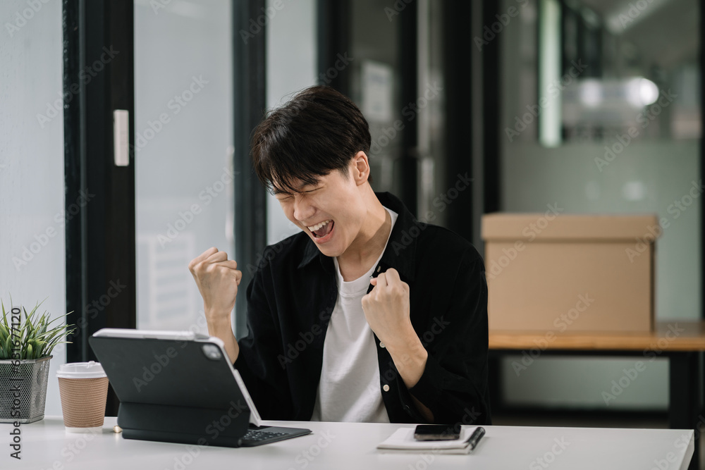 Happy excited tablet user enjoying, success, achieve, high job result. Euphoric businessman using cellphone, reading text message, feeling joy, making hand winner gesture, laughing Happy excited tablet user enjoying, success, achieve, high job result. Euphoric businessman using cellphone, reading text message, feeling joy, making hand winner gesture, laughing
