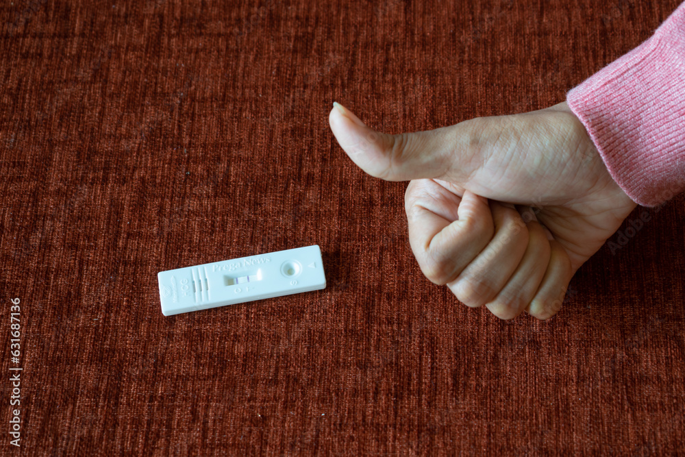 Pregnancy Test Kit Showing Positive Results With Thumbs Up Fertility