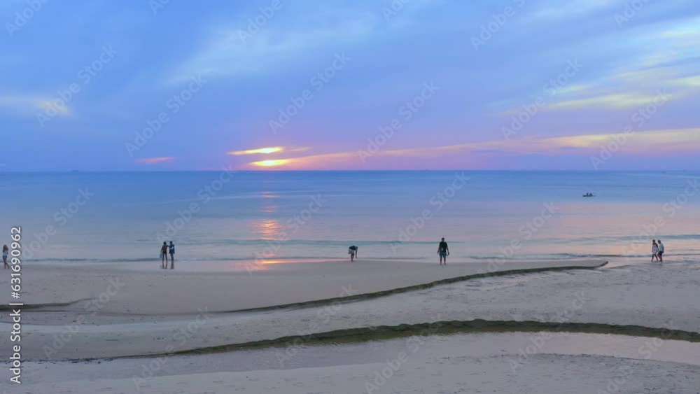 ..The winding canal on the sandy beach can be seen from an aerial view..The water in the pond flows into the canal to the sea..white bubble waves, and clear sand landscape. Paradise beach.. ..The winding canal on the sandy beach can be seen from an aerial view..The water in the pond flows into the canal to the sea..white bubble waves, and clear sand landscape. Paradise beach..
