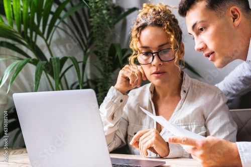 Close up of worker together using computer for small business. Man and woman team worker in small business job activity. People at office. Entrepreneur and assistant concept indoor online person photo