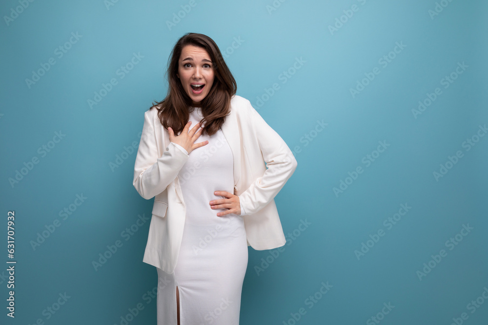 lucky happy brunette woman in dress on studio background with copyspace lucky happy brunette woman in dress on studio background with copyspace