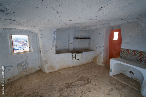 Interior of Arguedas caves with kitchen and white walls, in Spain photo