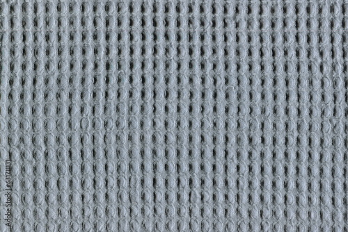 The texture of coarse natural fabric is gray. Practical homemade, soft duster for dust, kitchen, housework.