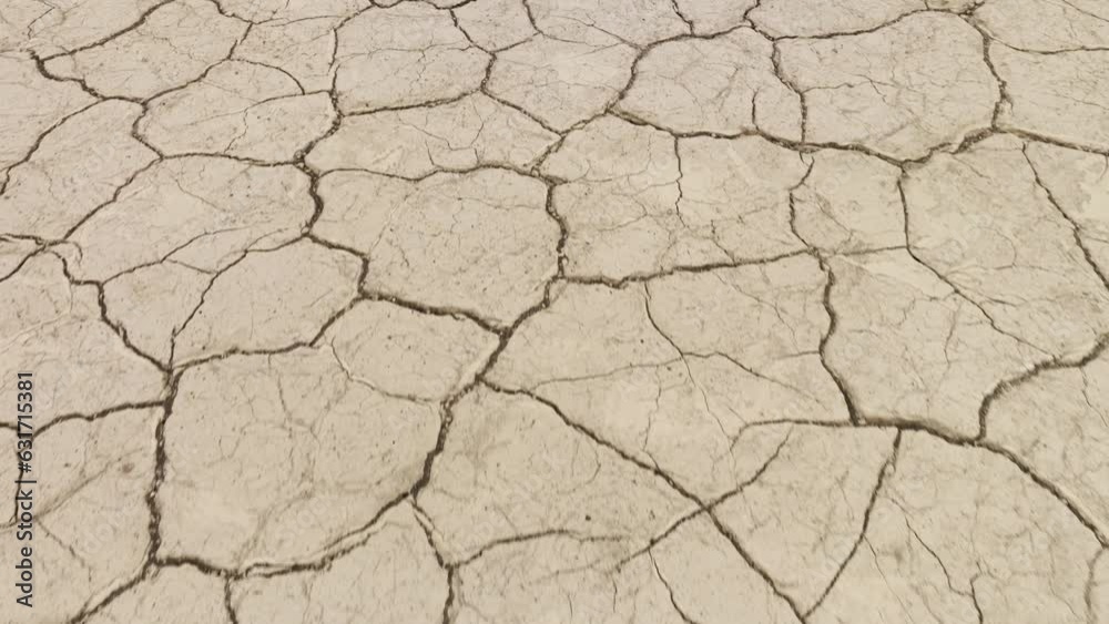 Aerial shot looking down at the cracked surface of a dry lake. Aerial shot looking down at the cracked surface of a dry lake.