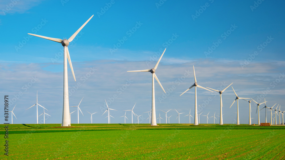 Wndmill park in the ocean aerial view with wind turbine Flevoland Netherlands Ijsselmeer. Green Energy in the Netherlands on a sunny day Wndmill park in the ocean aerial view with wind turbine Flevoland Netherlands Ijsselmeer. Green Energy in the Netherlands on a sunny day