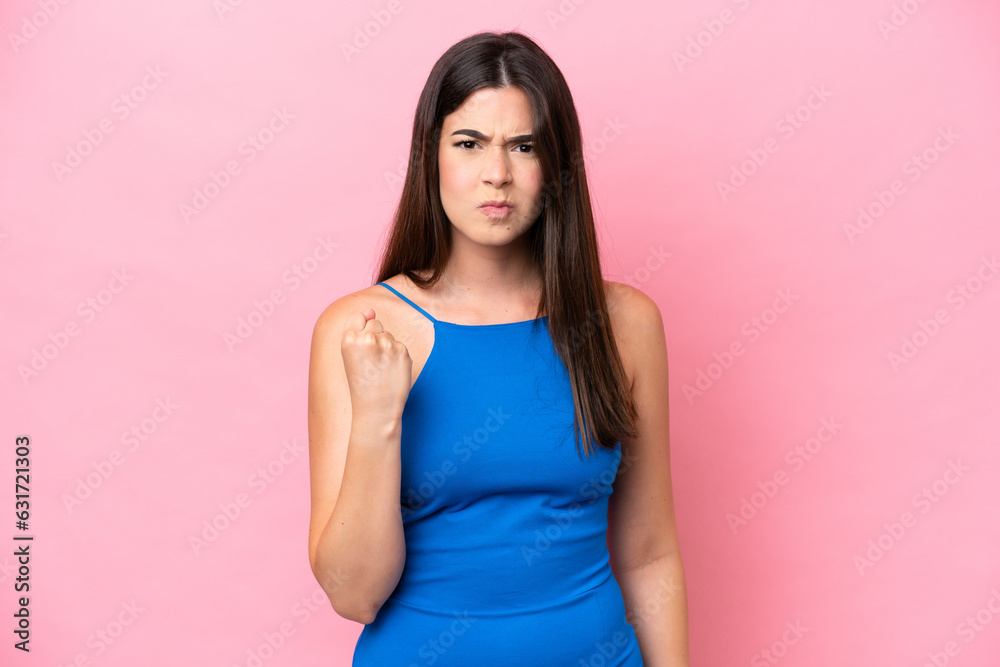 Young Brazilian woman isolated on pink background with unhappy expression Young Brazilian woman isolated on pink background with unhappy expression