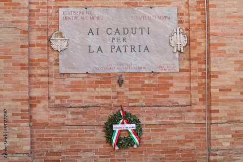 Monument to the fallen in war, translation is 'to the fallen who died for their country' in Piazza Leopardi Recanati Le Marche central Italy placed in 1961 on the 100th anniversary of the unification photo