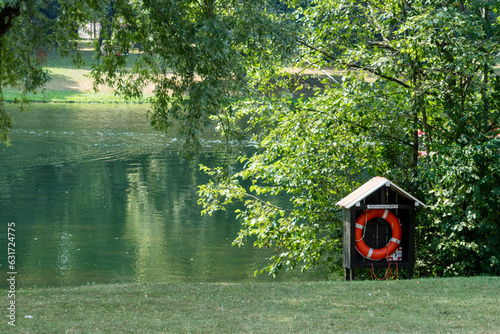 Life ring in a wooden hut alongside a lake