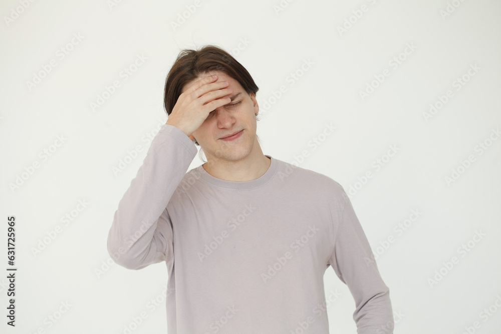 Portrait of young man holding his hand with his head Portrait of young man holding his hand with his head
