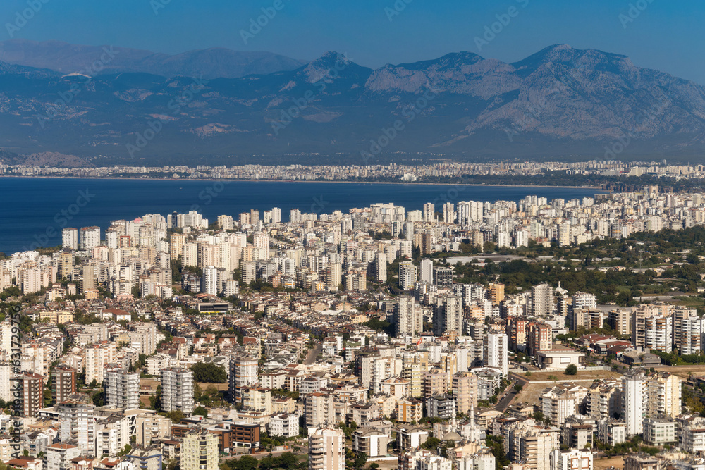 Fototapeta premium Aerial view of Antalya in the morning. Coast, buildings and the sea. Urbanisation concept. Travel to Turkey concept. 