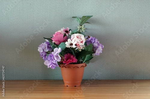A flowers in a vase on a wooden table in the cafe, decoration concept.