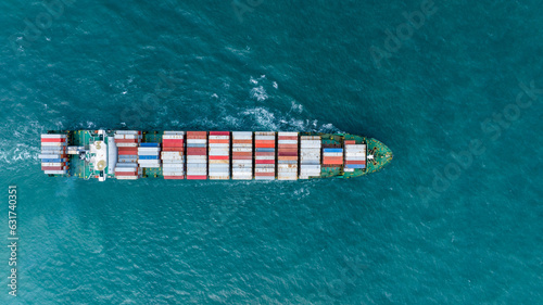 op View Cargo container Ship, cargo maritime ship with contrail in the ocean ship carrying container and running for export concept technology freight shipping sea freight by Express Ship
