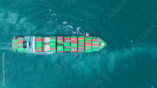 op View Cargo container Ship, cargo maritime ship with contrail in the ocean ship carrying container and running for export concept technology freight shipping sea freight by Express Ship