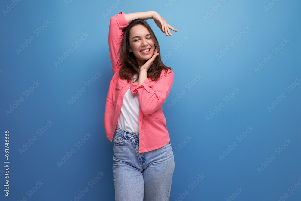 portrait of stylish dark haired young woman with hollywood smile isolated with studio background portrait of stylish dark haired young woman with hollywood smile isolated with studio background