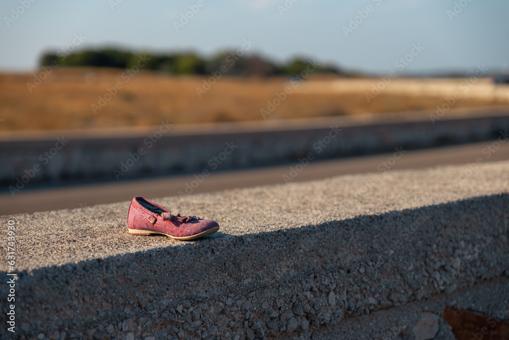 a girl's shoe on the road a girl's shoe on the road