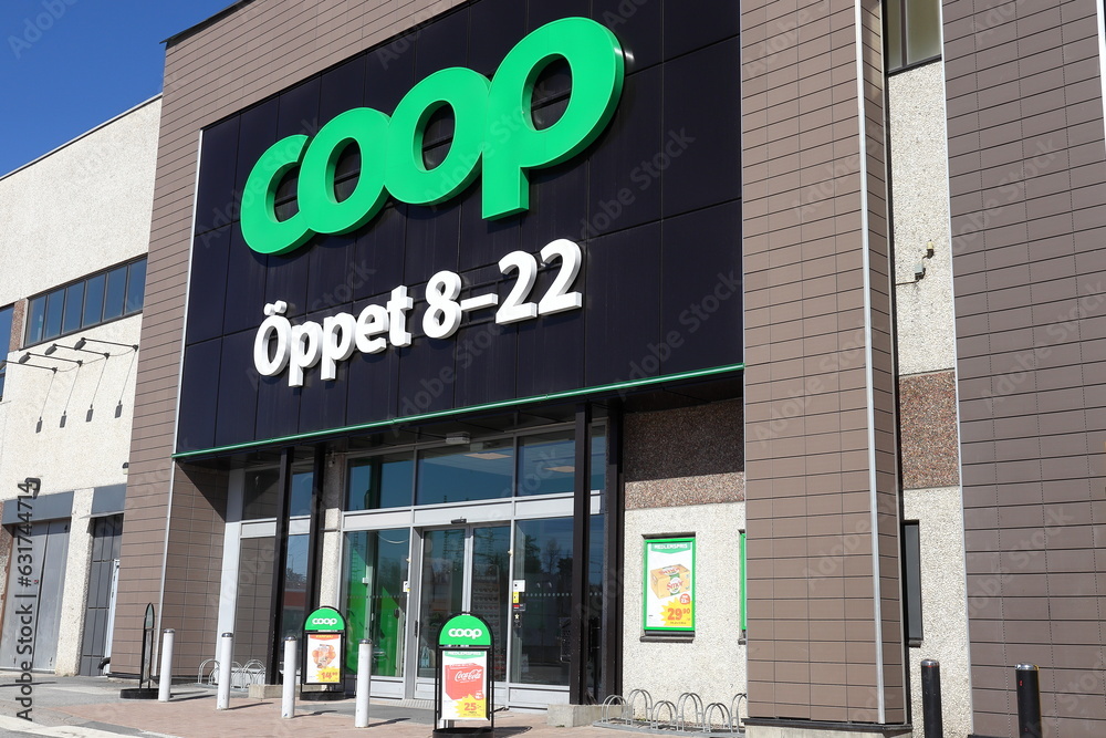 Entrance and exit of a Coop grocery store. Swedish company also known as Konsum. Stock Photo