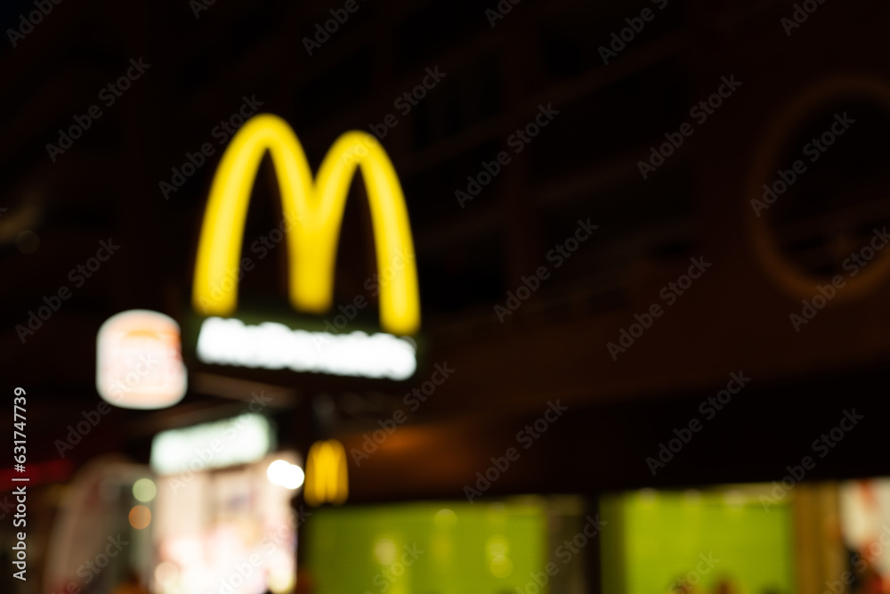 Tarragona, Spain 09 June 2023 Blurred photo. McDonald's Arches sign