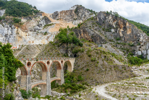 old stone bridge in the ponte di vara, carrara italy photo