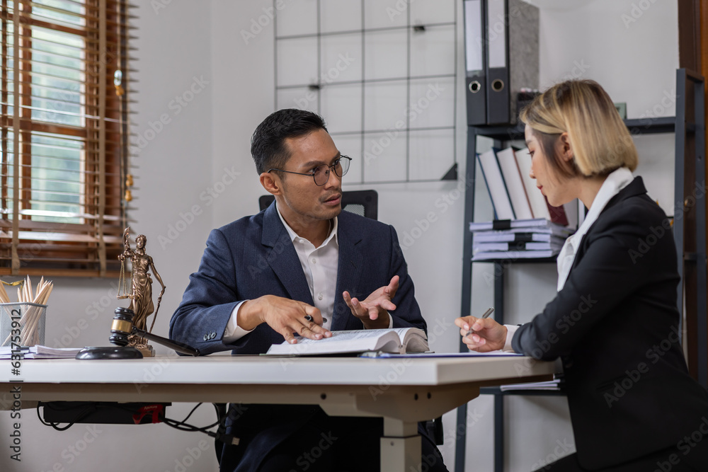 Business Asian people and lawyers, Businessman and lawyer discuss the contract document. Judge gavel deciding on marriage divorce signing papers. lawyer concept. Business Asian people and lawyers, Businessman and lawyer discuss the contract document. Judge gavel deciding on marriage divorce signing papers. lawyer concept.