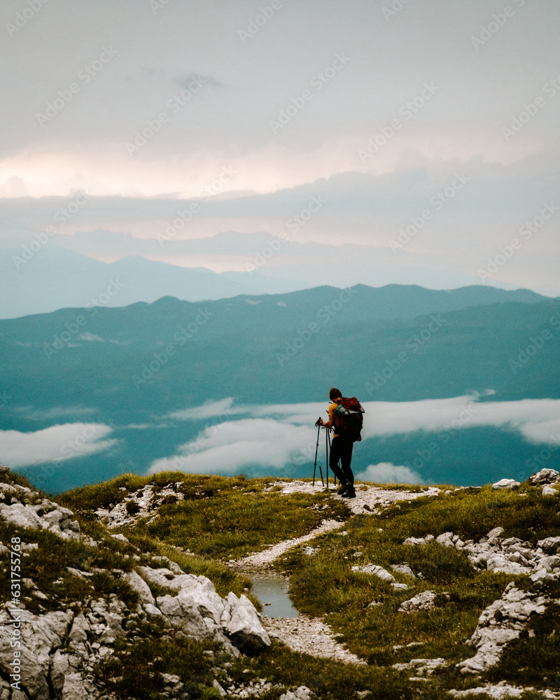 Fototapeta premium person on the top of the mountain