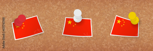 China flag pinned in cork board, three versions of China flag.